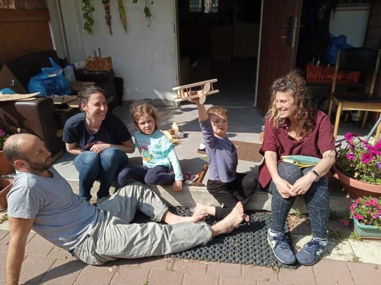 A family making something together outdoors