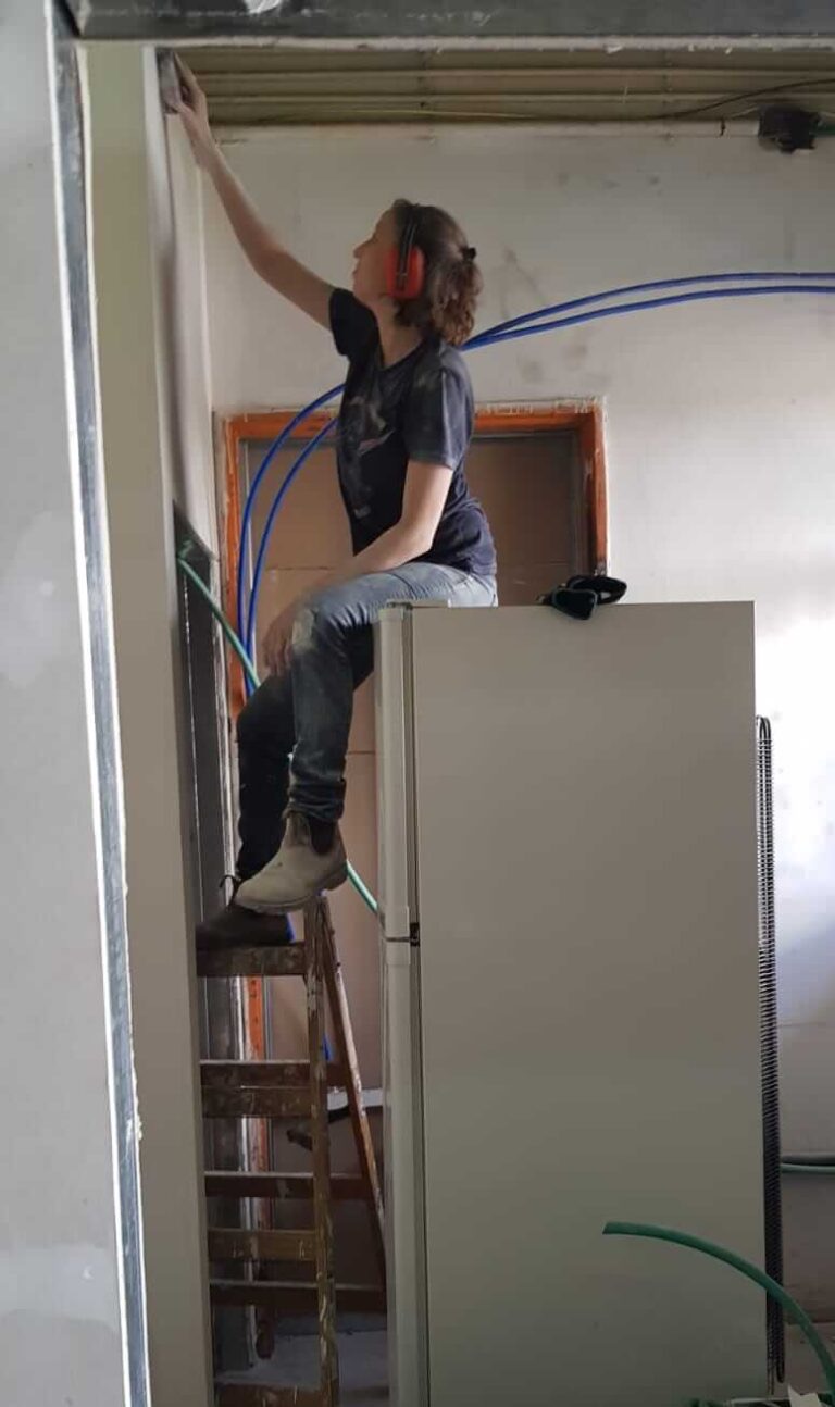Fixing something high up on a ladder